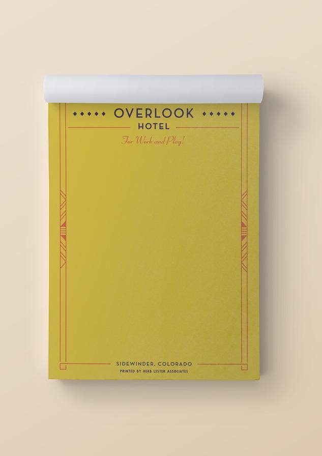 Yellow notepad with 'Overlook Hotel' text on a beige background