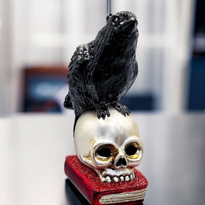 Decorative ornament with a skull and crow on a blurred background