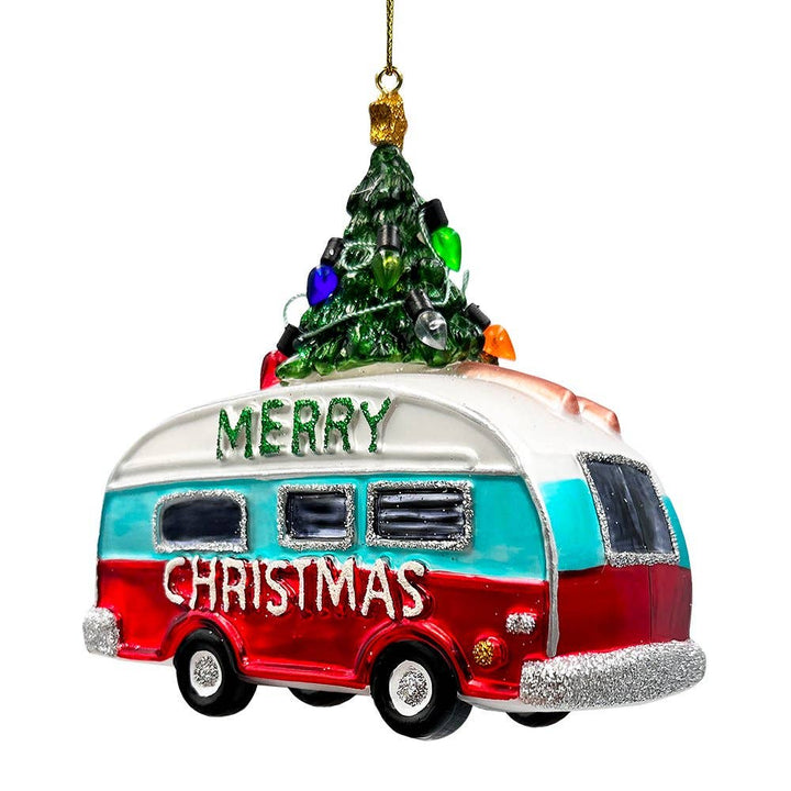 Decorative Christmas ornament shaped like a camper with a tree on top, featuring 'Merry Christmas' text.
