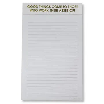 Notepad with motivational quote on a white background
