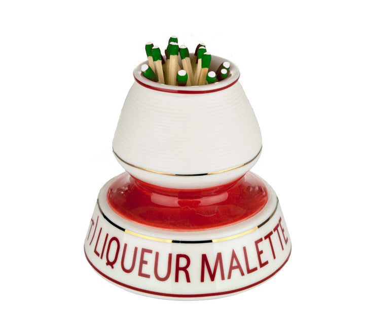Ceramic match striker with matches on a white background