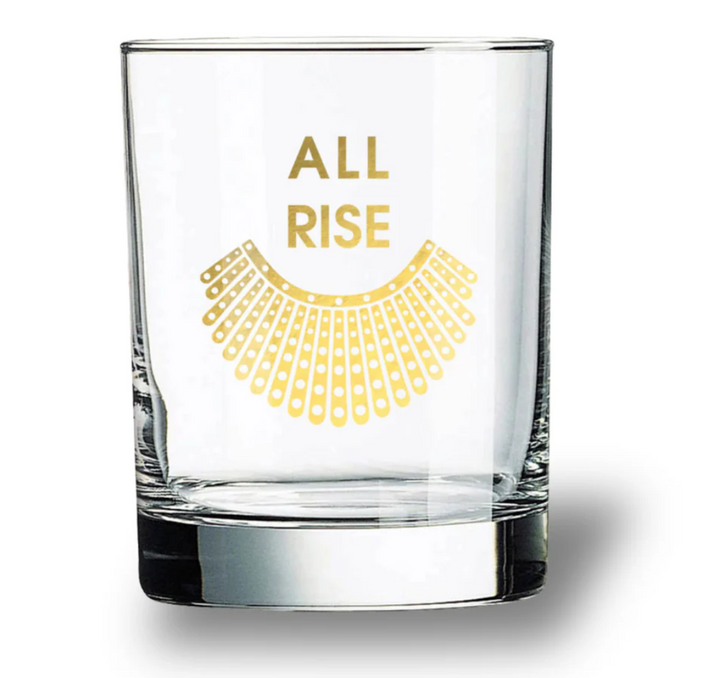 Clear rocks glass tumbler with 'All Rise' painted in gold foil on a white background